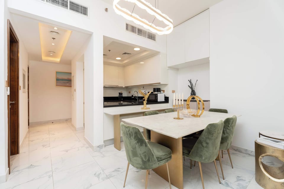 Sophisticated dining area. Features a sleek table, designer chairs, and ambient lighting—perfect for enjoying meals in a serene, scenic setting.