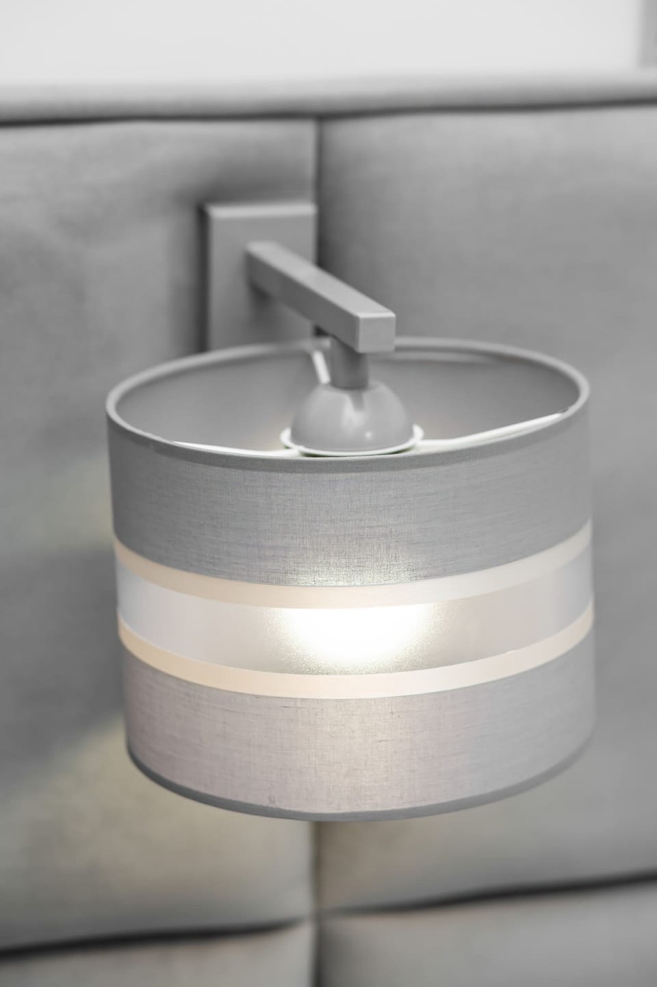 Close-up of the bedside lamp next to the bed.