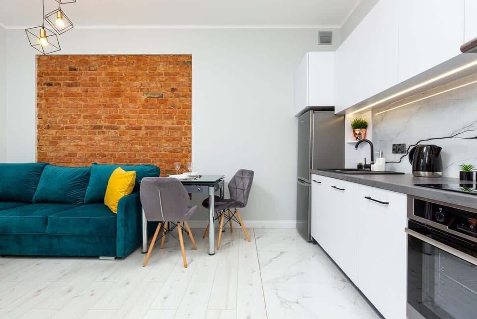 The living area's bold color palette creates a cheerful and inviting atmosphere.