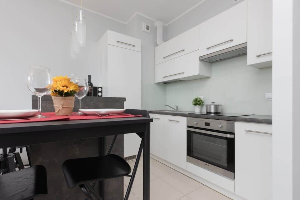 Dining table positioned next to the kitchenette.