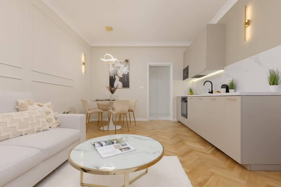 A wider perspective of the open-plan layout, combining the living, kitchen, and dining areas in a cohesive design.
