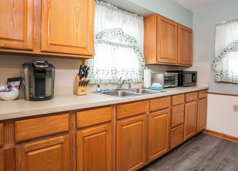The cozy kitchen offers ample storage & every home comfort​