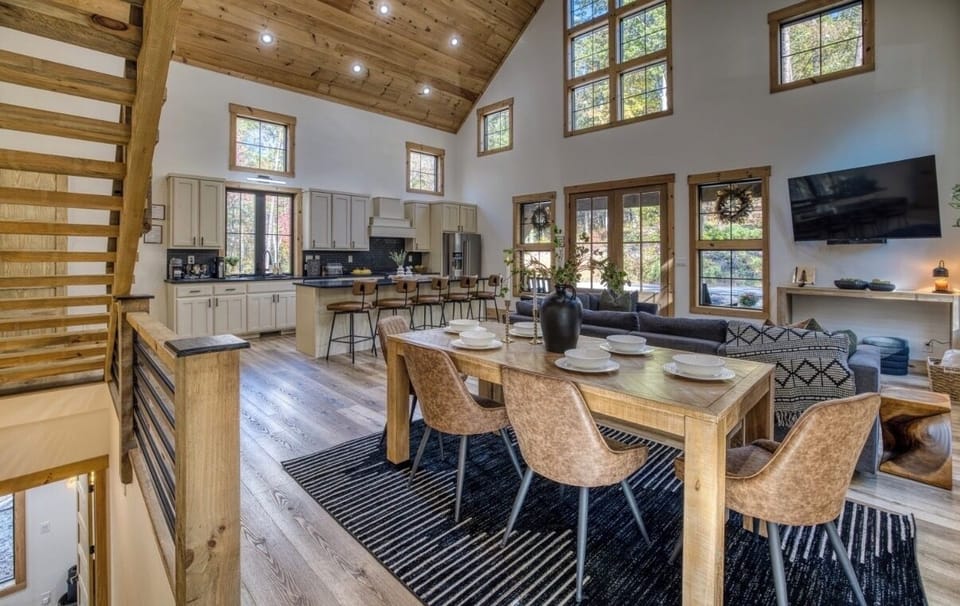 Spacious open-concept kitchen and dining area with vaulted ceilings