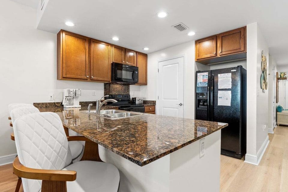 Pristine kitchen with bar seating