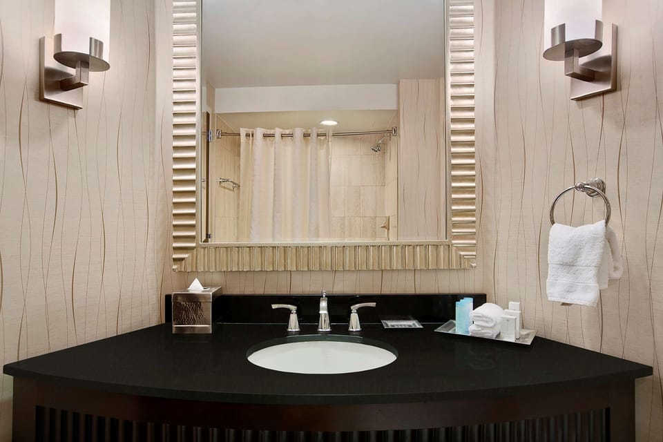 Combined shower/tub, designer toiletries, hair dryer, bathrobes