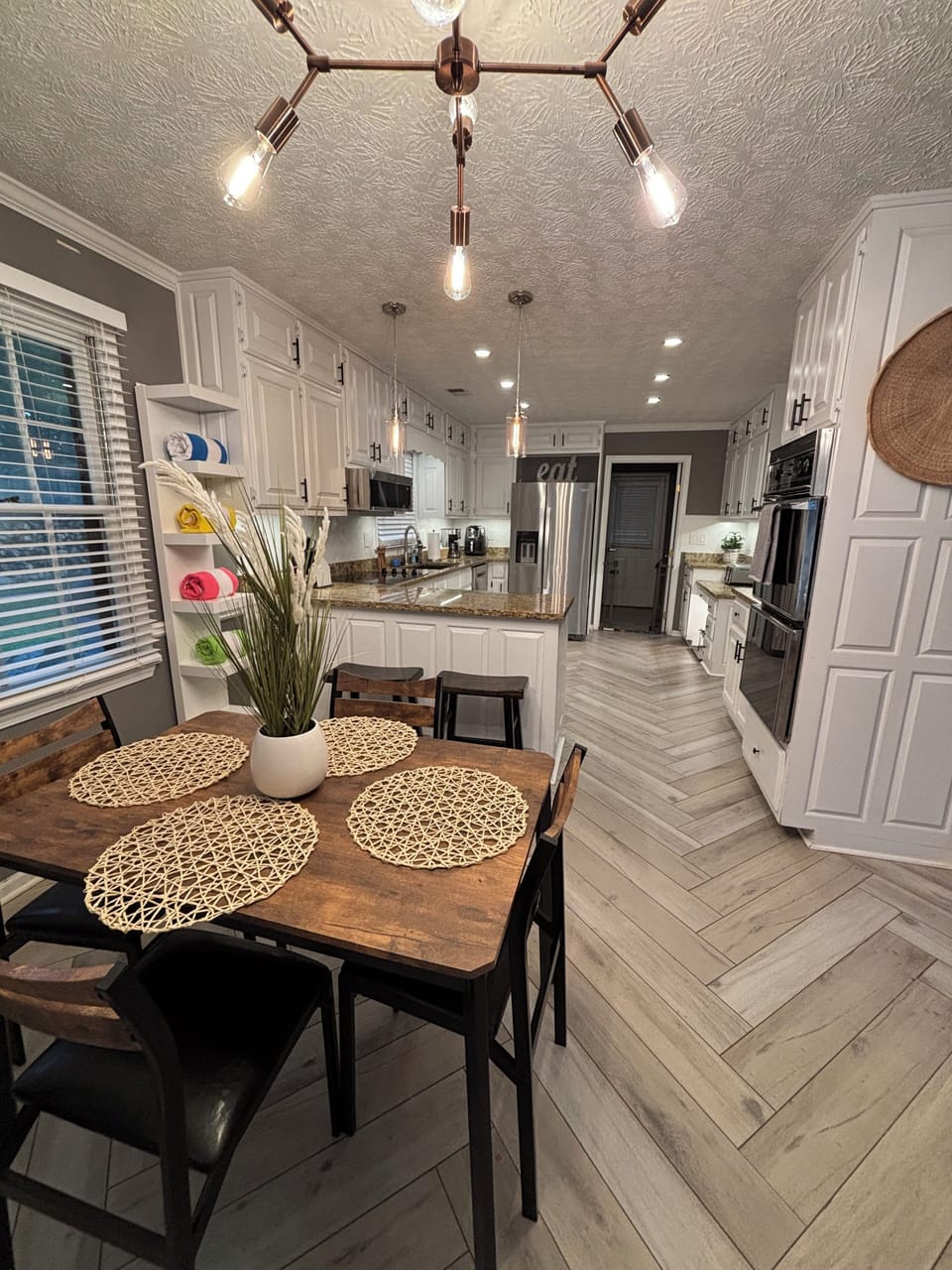 Breakfast room off kitchen with additional counter stools