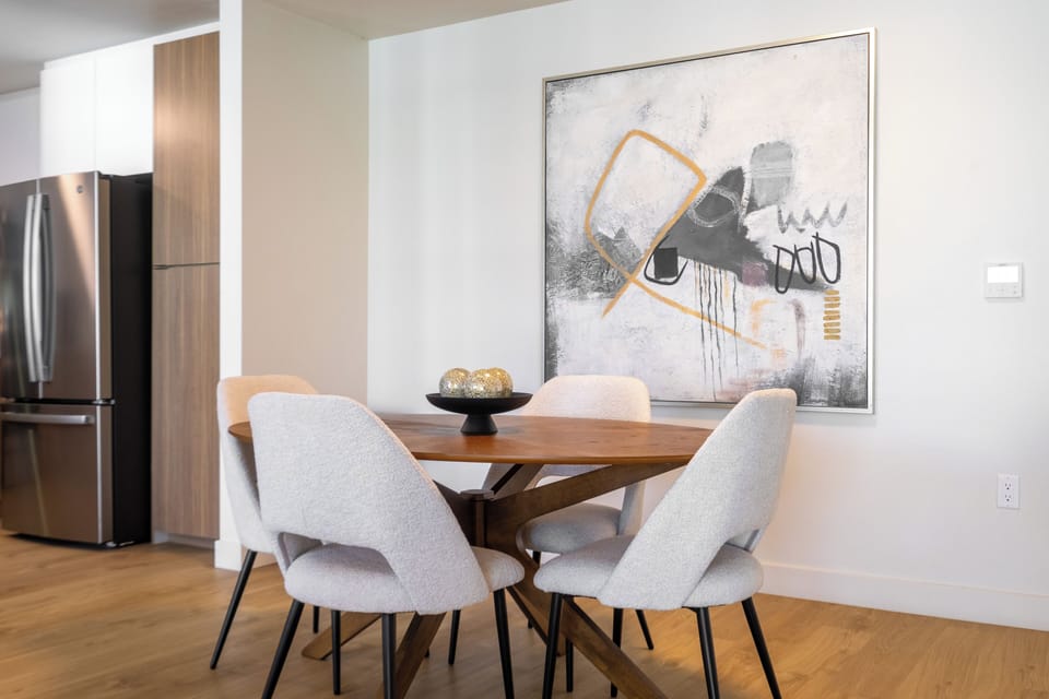 Gorgeous abstract art creates a sophisticated backdrop for dinner.