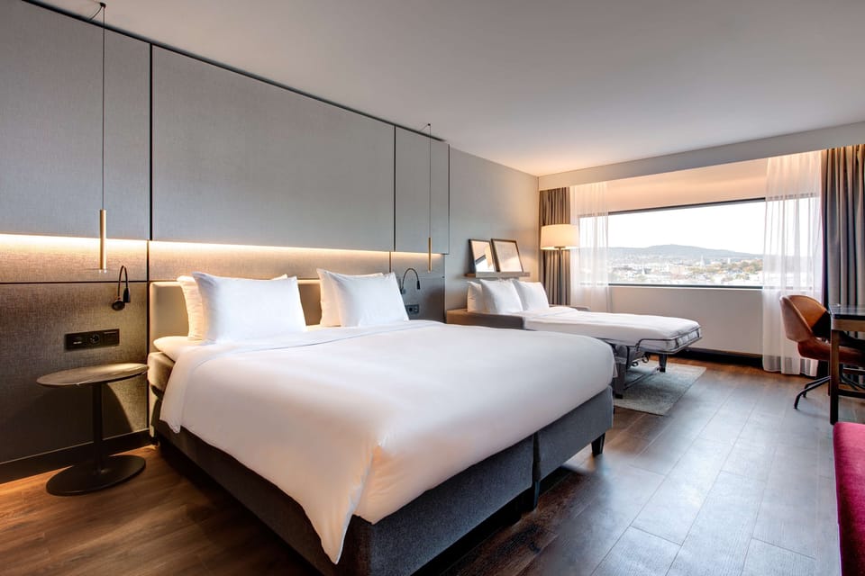 Premium bedding, down comforters, pillowtop beds, in-room safe