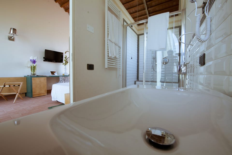 Junior Triple Room, Private Bathroom, Garden View | Bathroom | Shower, rainfall showerhead, eco-friendly toiletries, hair dryer