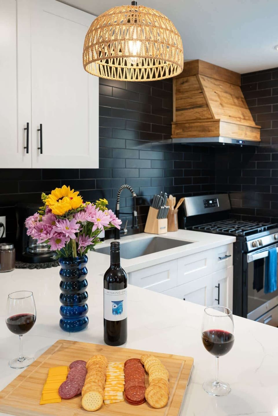 Kitchen Paradise: Sip wine amid elegant decor, stylish lighting, and a perfect spot for gatherings.