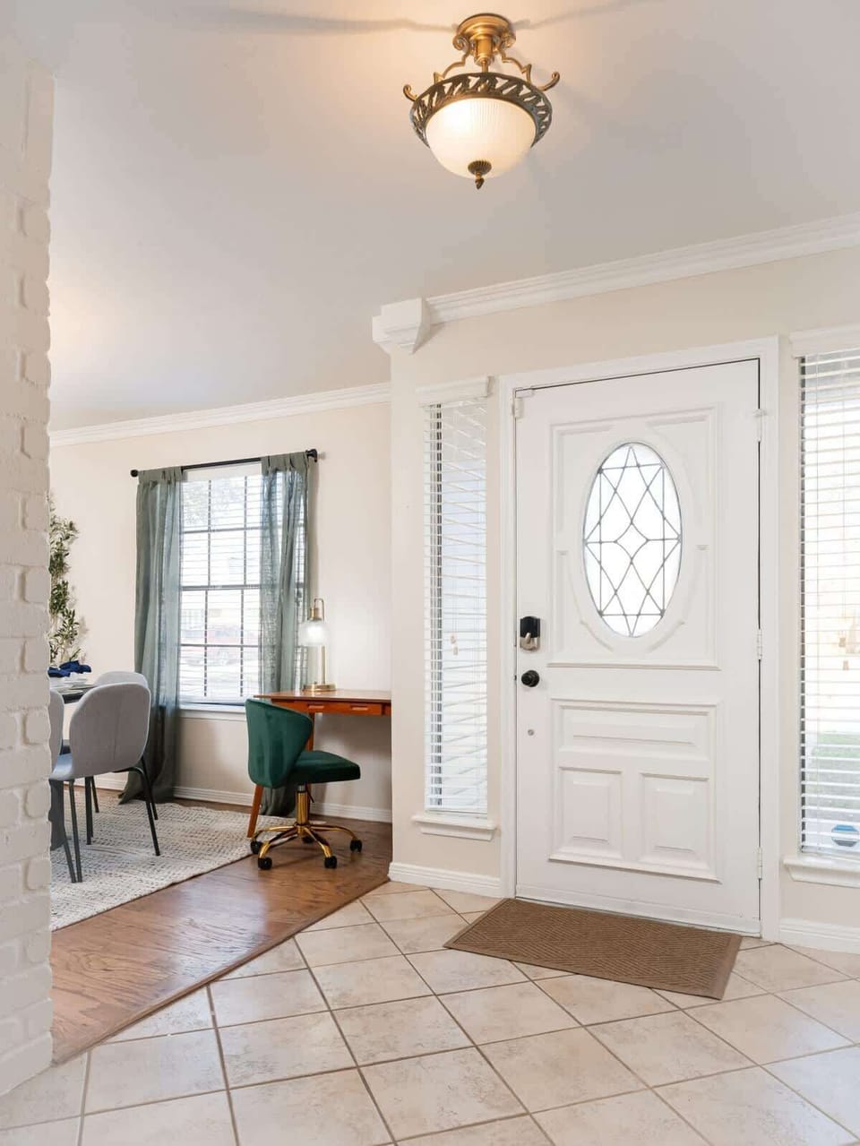 Entryway: Step into this stylish entry featuring elegant lighting and a perfect workspace.