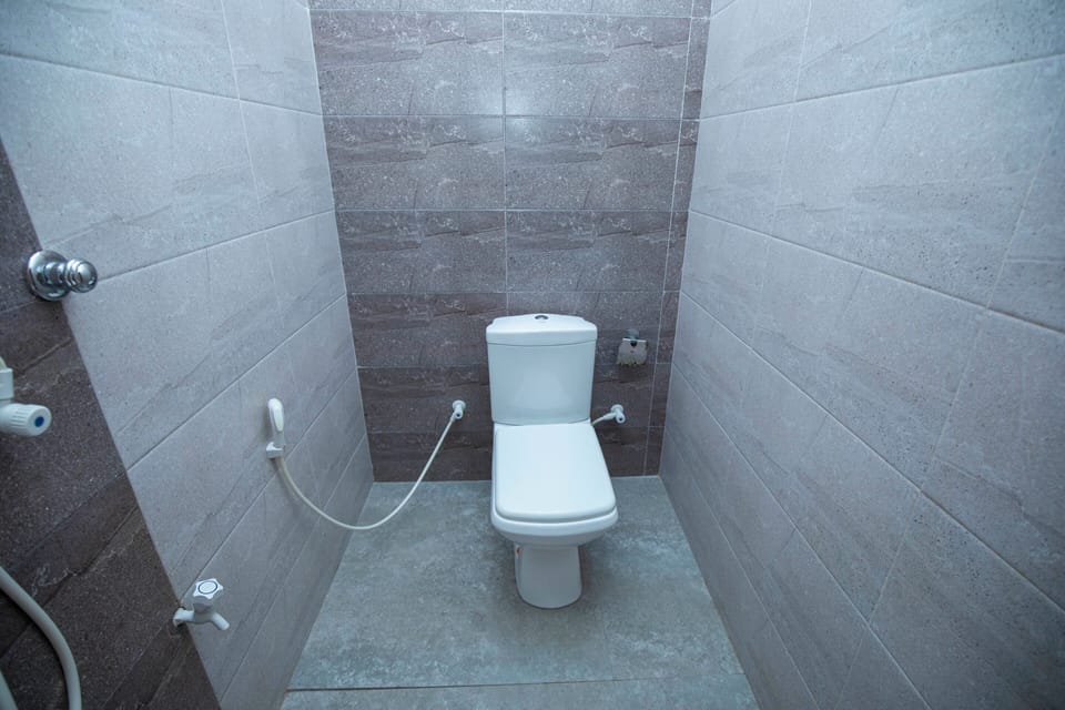 Family Quadruple Room, Multiple Beds, Air conditioning, Garden View | Bathroom | Shower, hydromassage showerhead, bidet, towels