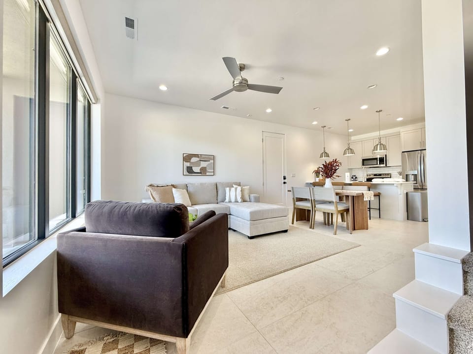 Open-concept living area perfect for family time — enjoy meals, movies, and mountain scenery all in one bright, airy space!