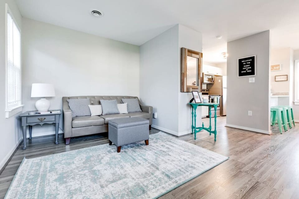 Kick back in comfort on the cozy leather sofa! Enjoy a movie night on the large Roku TV or browse local brochures for things to do—all in a bright, open-concept layout that flows into the kitchen and dining area.