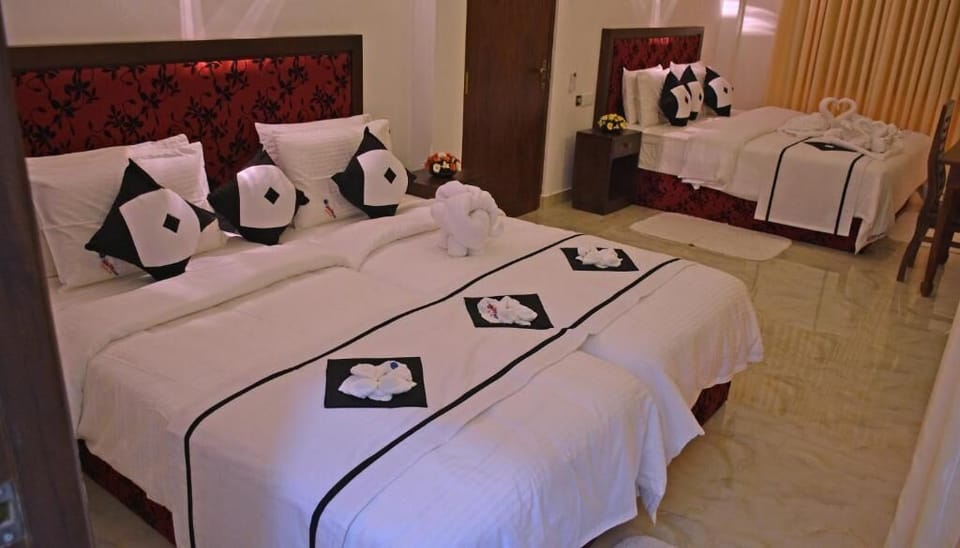Deluxe Quadruple Room, Balcony | In-room safe, iron/ironing board, free WiFi, bed sheets