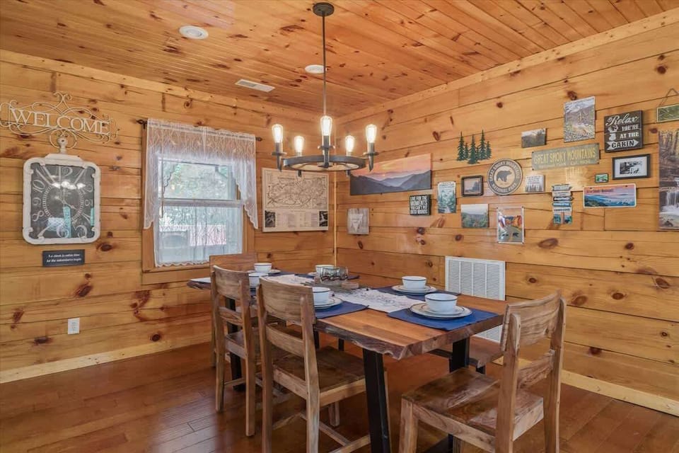 Gather around the rustic table, adorned with local art and warm wooden charm!