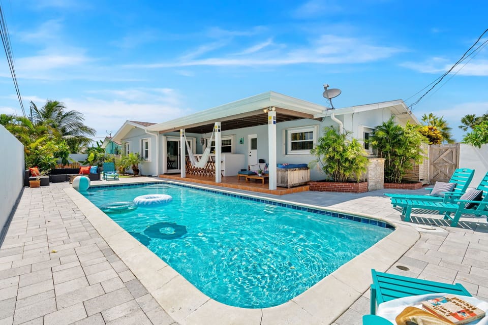 Private pool with lounge seating and hammock ready for your next relaxing day.