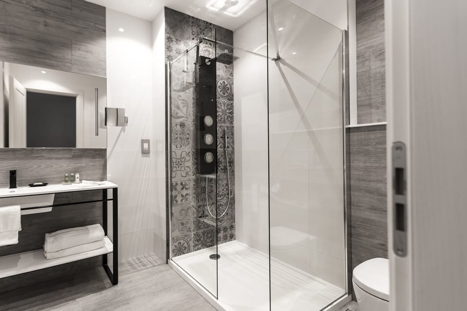 Designer toiletries, hair dryer, bathrobes, towels