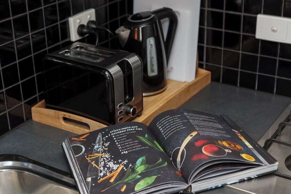 The compact kitchen is perfect for whipping up breakfast, lunch or dinner thanks to a double sink, oven, stove and dishwasher for easy clean up