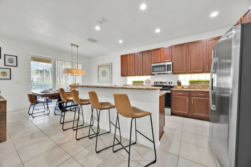 Gather ‘round! 🍽️ This open-concept kitchen is perfect for families and groups, featuring a spacious layout and four high-top bar stools—ideal for casual meals, morning coffee, or late-night snacks.