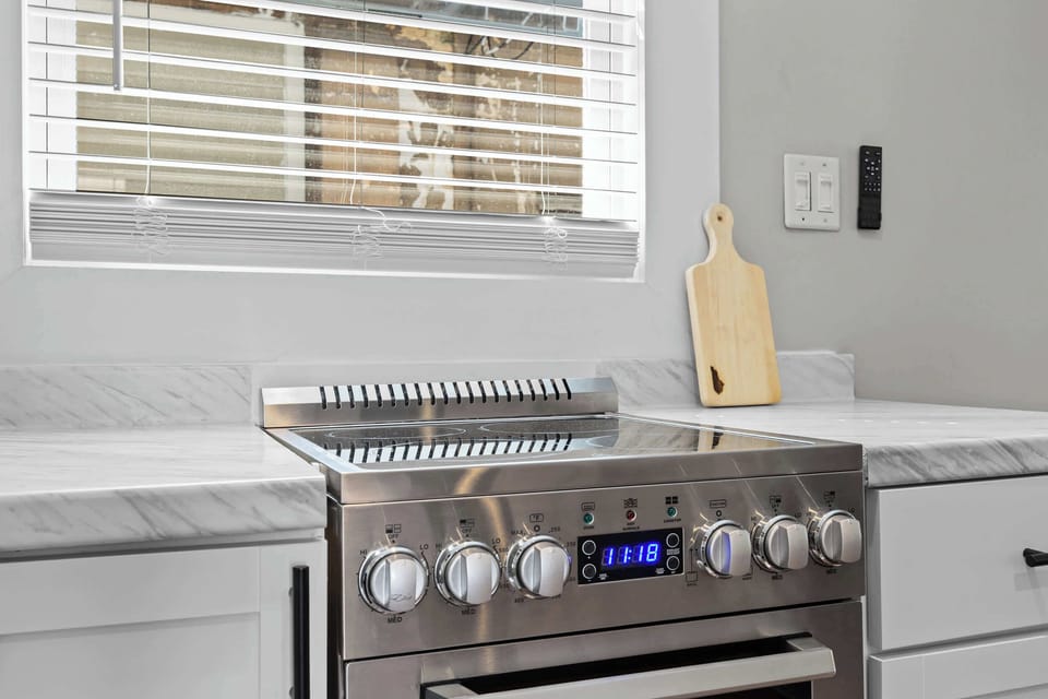 Kitchen: Whip up your favorite meals in this fully equipped kitchen — where modern amenities meet homey charm for a seamless cooking experience.