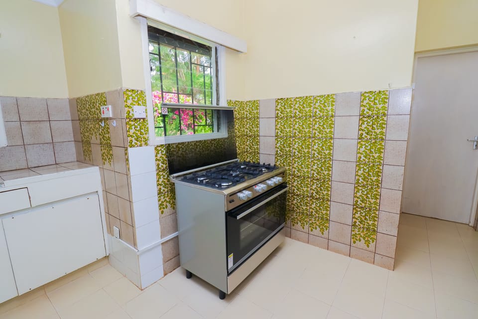 The kitchen features a large cooking range