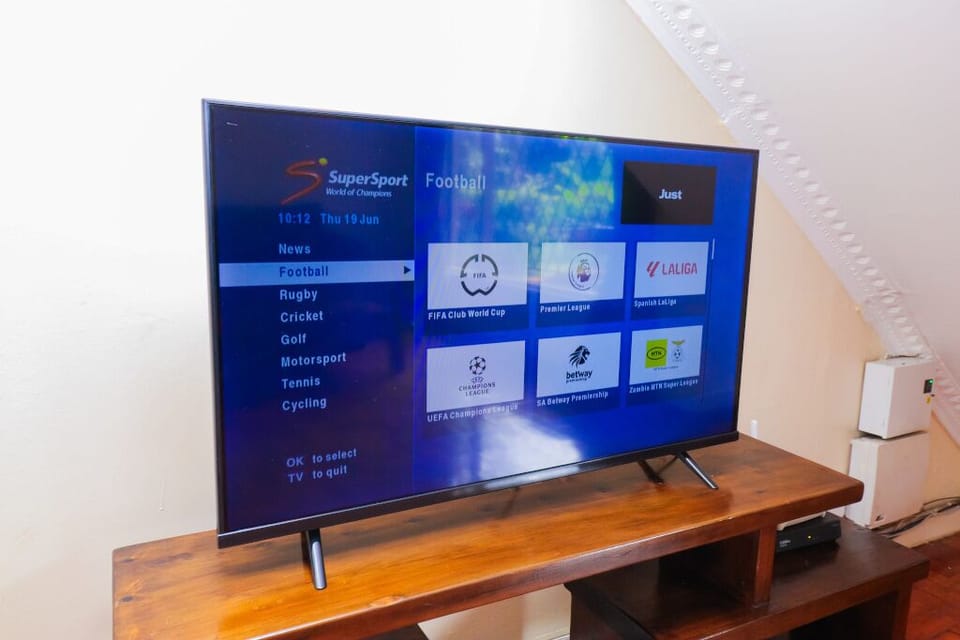 Smart TV for Netflix and other streaming apps and also features DSTV. 