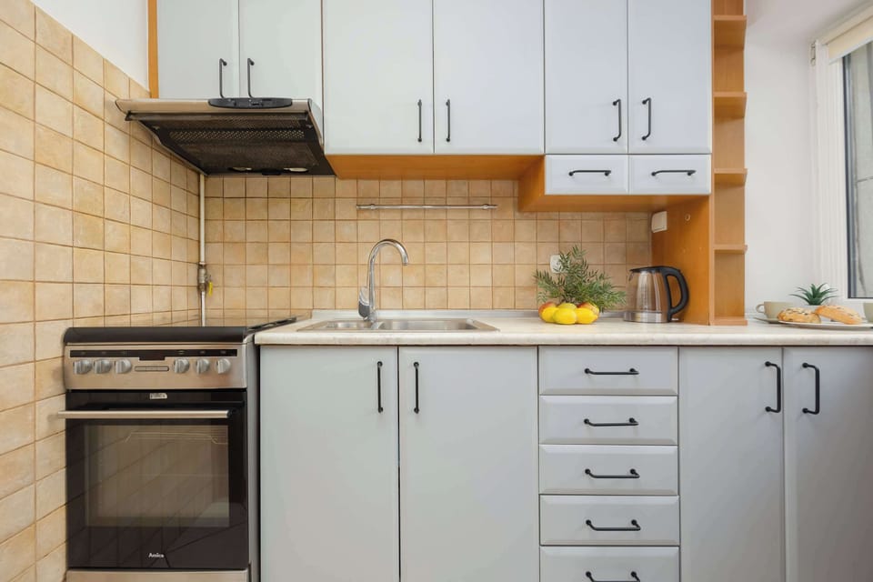 A functional kitchen with an oven and stovetop lets you prepare home-style meals with ease.
