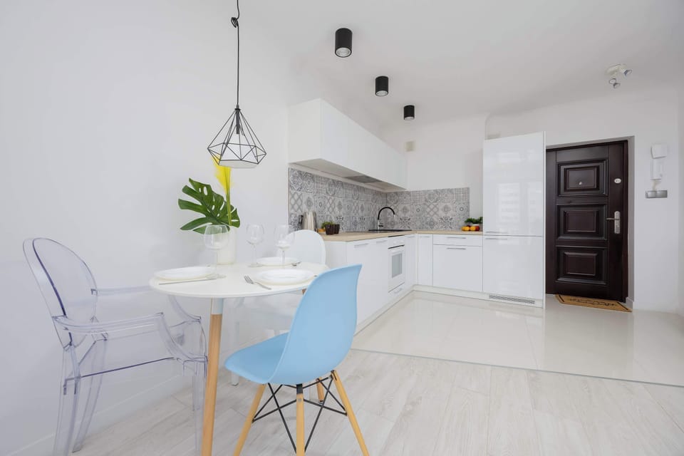 A bright dining area with designer lighting makes the perfect spot for your morning coffee.