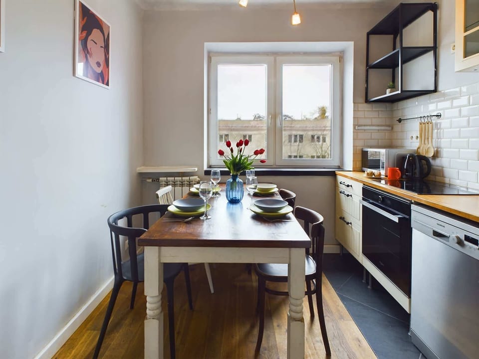 Natural light streams in through the kitchen window, enhancing the unique character of the room.