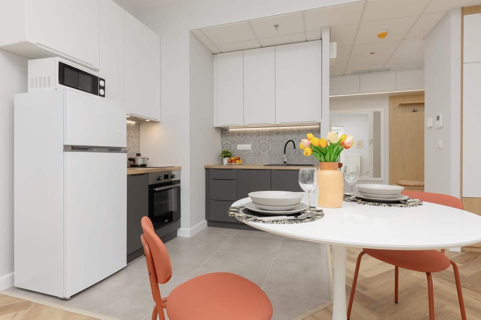 Kitchenette with a fridge.