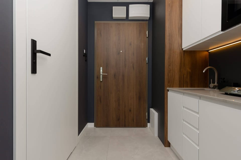 Kitchenette with a fridge.