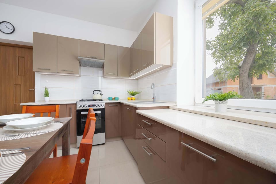 Kitchenette with customised furniture with white goods. Gas cooker with oven. 
