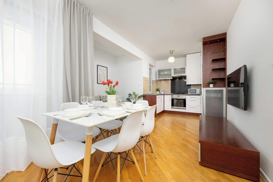 Large table with chairs for eating communal meals. 