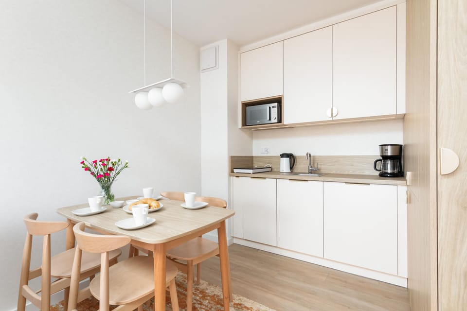 Kitchenette with dishwasher and microwave.