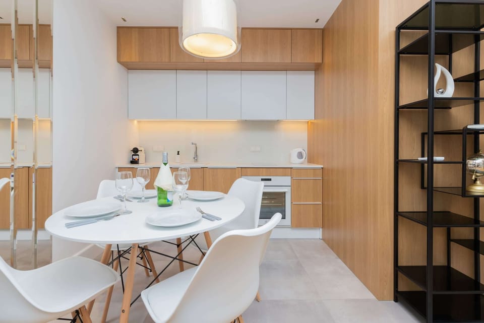 The living area's elegant decor is complemented by stylish floors. 