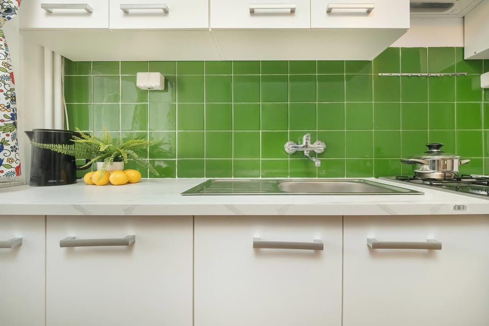 Green kitchen with tea and coffe.