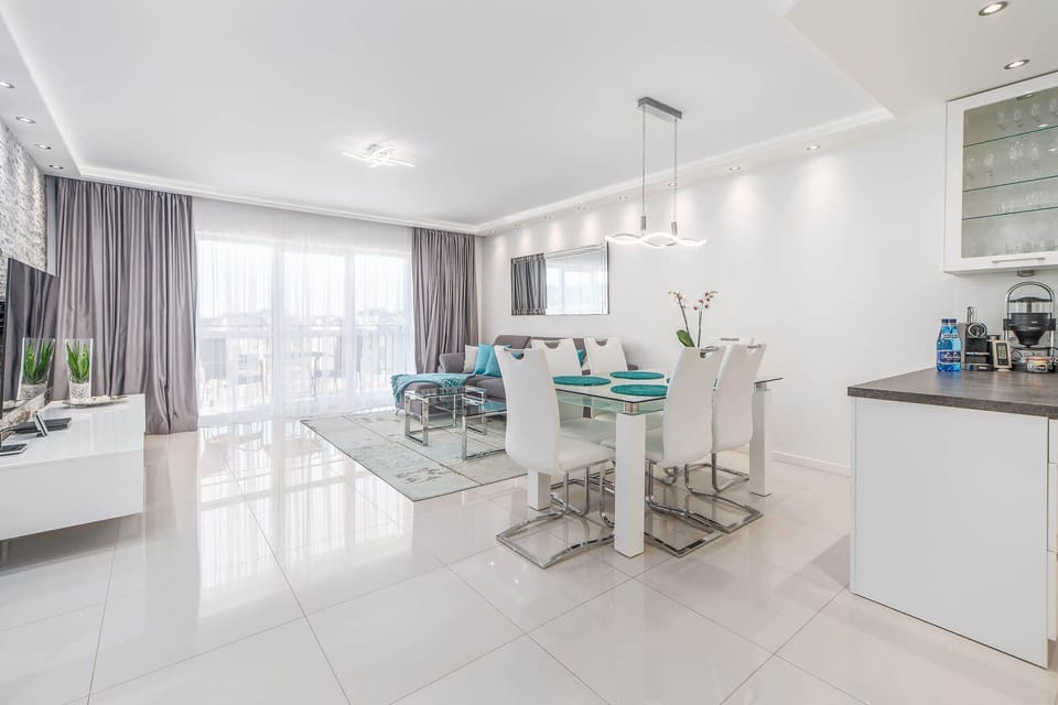 Living room combined with kitchenette. The decor of the room is bright and modern. 