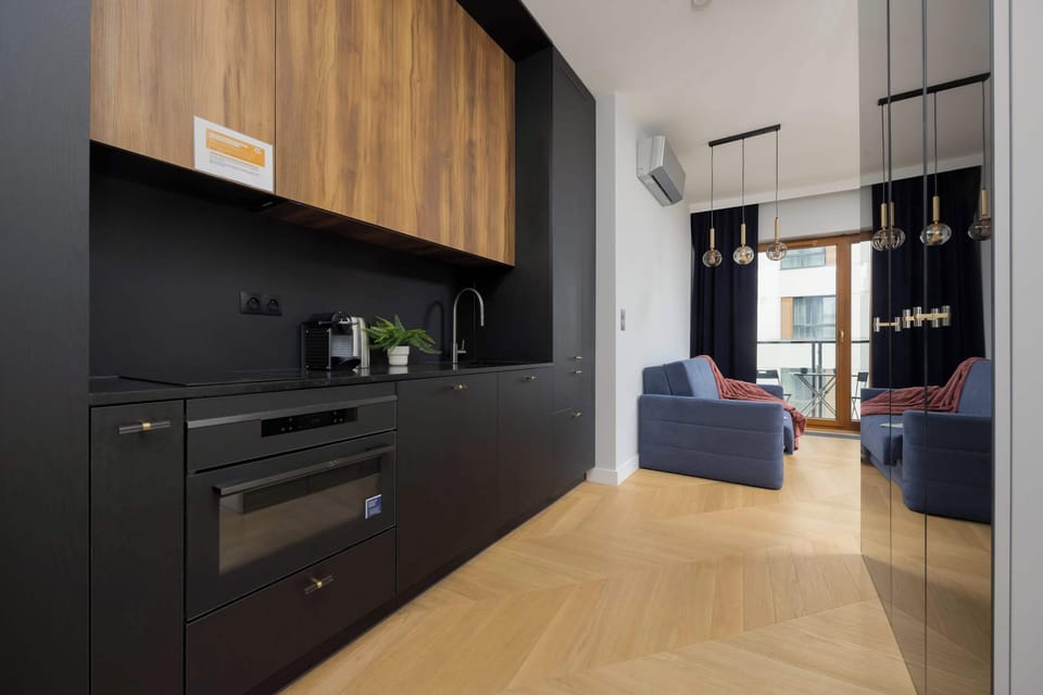 The open kitchen with a view of the living area and balcony encourages shared moments.