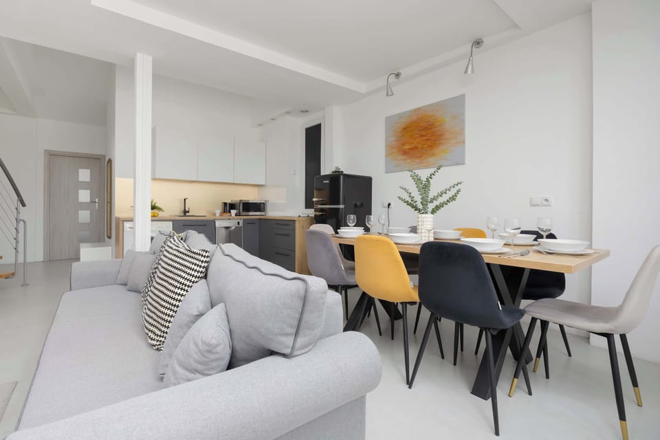 A wide view of the open-plan living and dining space, showcasing comfort and functionality.