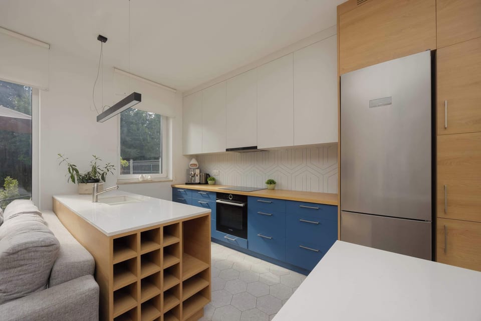 Functional, bright kitchen with plenty of cabinets and a spacious worktop.