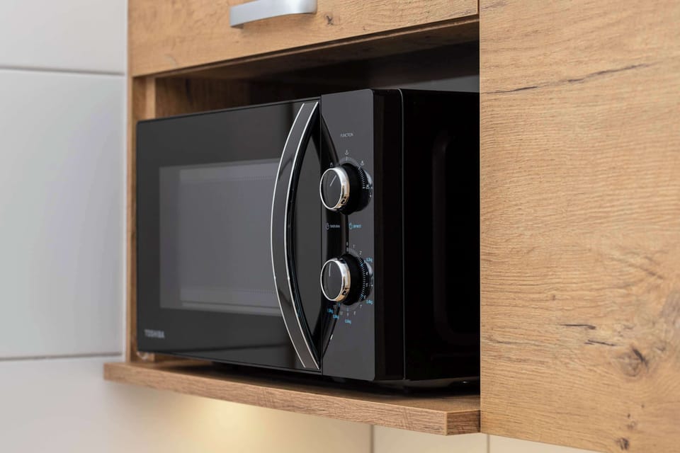 Kitchenette with a microwave.