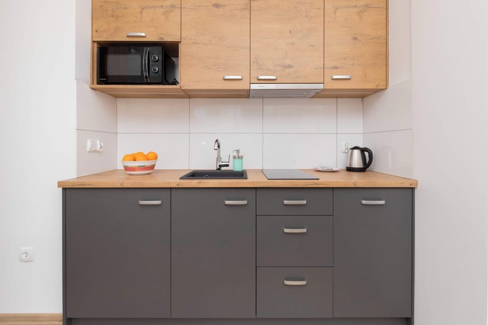 Kitchenette with a microwave.