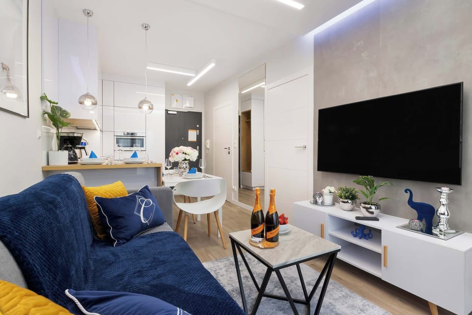 Living room with a comfortable sofa and TV. 