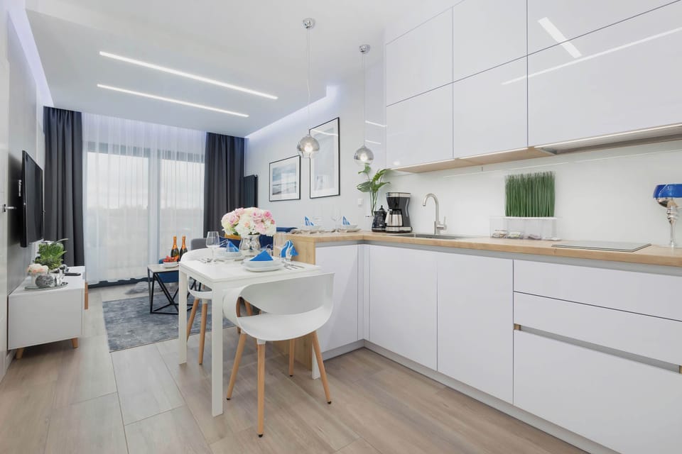 Kitchenette with oven and refrigerator. 
