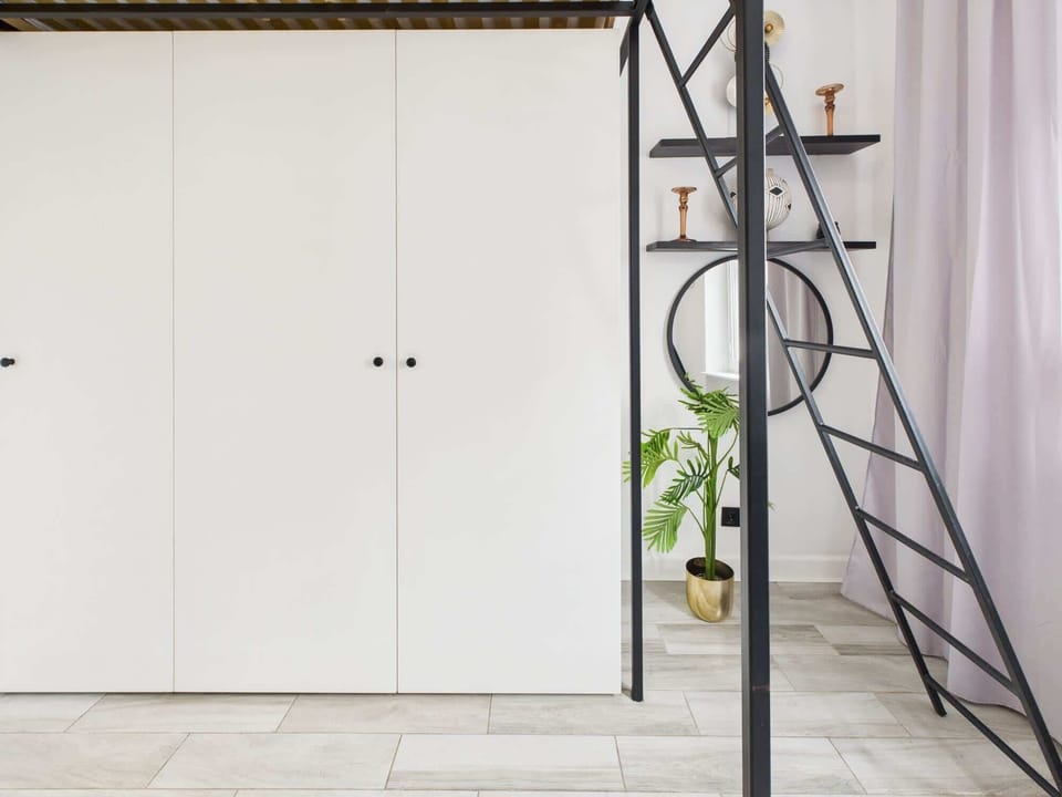 A built-in closet that offers plenty of storage space so the space stays organized.