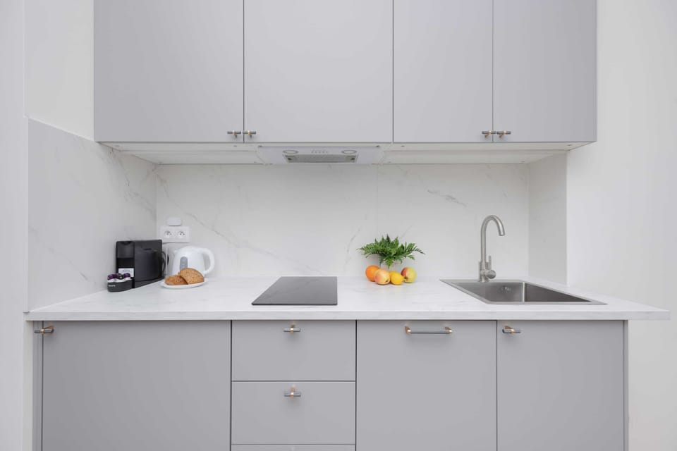 The fully equipped kitchenette includes everything you need for a home-cooked meal.