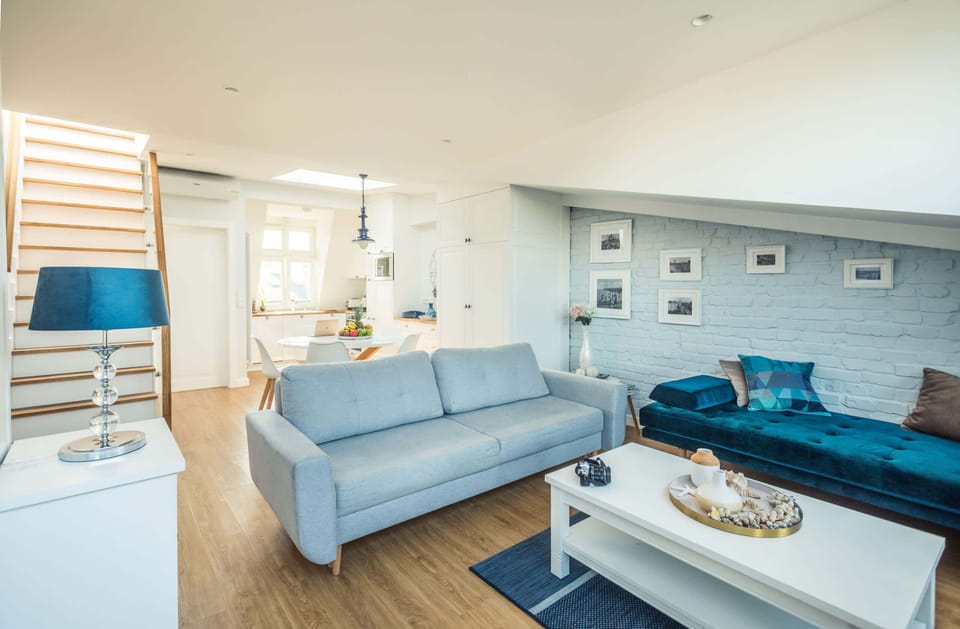 Living room with a comfortable sofa and TV. 