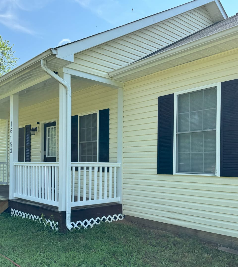 Front porch with rocking chairs.