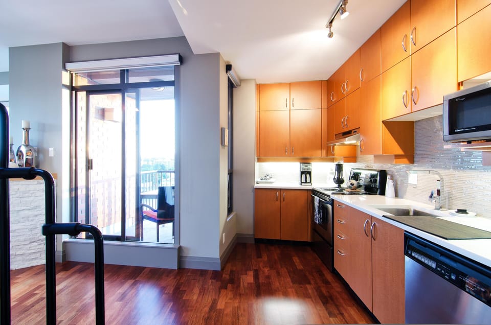 Kitchen with wood cabinetry and natural light